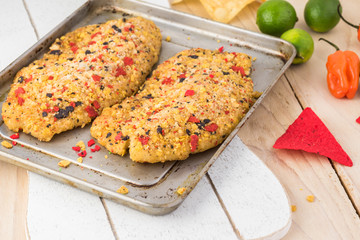 Uncooked tortilla crusted tilapia