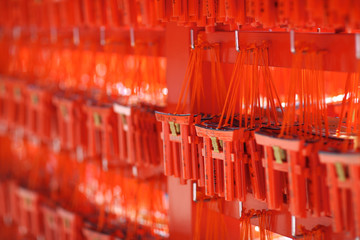 Small souvenir torii-gates to visitors at the stand on the territory of a Shinto temple in the Japanese city