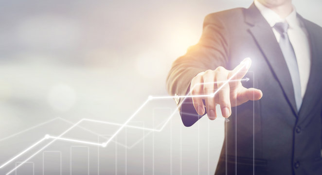 Development and growth concept. Businessman plan growth and increase of positive indicators in his business.