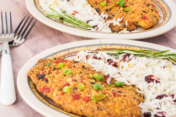 Baked tortilla crusted tilapia with cranberry rice.