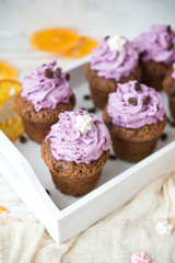 Chocolate muffins with berry cream for a holiday
