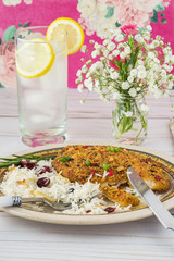 Baked tortilla crusted tilapia with cranberry rice.