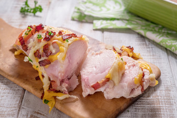 Chicken breast baked with cheese, bacon and tomatoes