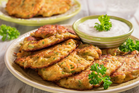 Vegetable fritters with potato, carrot, zucchini served with Ranch sauce.