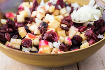 Mixed ingredients for homemade, healthy, beet cranberry, apple salad.