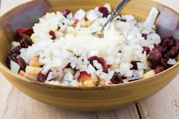 Mixed ingredients for homemade, healthy, beet cranberry, apple salad.