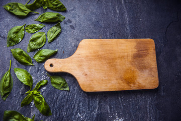 basil leaves on food background with kitchen desk