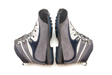 A pair of grey trekking boots isolated on white