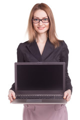 Young smiling business woman presenting laptop