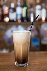 alcohol cocktail on wooden bar with bar background