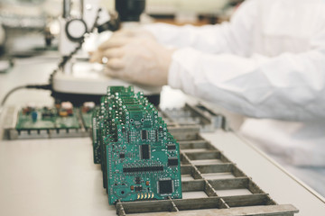 Microchip production factory. Technological process. Assembling the board. Computer expert....