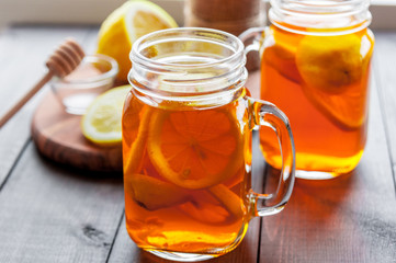 Hot tea with lemon and natural honey, good treat to have vitamins and strong immunity.