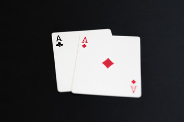 Playing poker cards aces on black background
