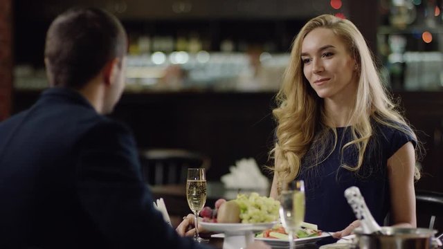 beautiful blondie has a date in restaurant with her man