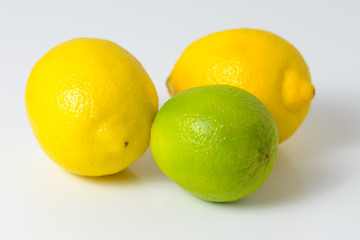 Lemons and limes on a white background.