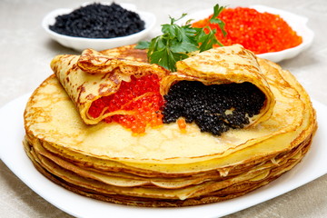 Pancakes with red and black caviar.