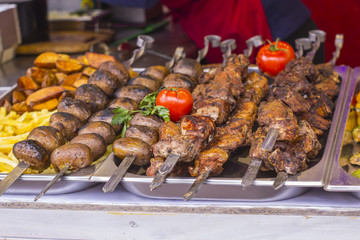 iece of delicious shish kebab and pepper skewers grilling on the grill