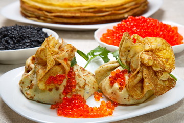 Pancake pouches with red and black caviar.