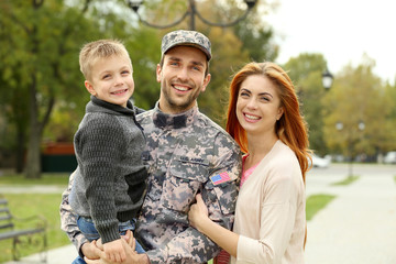 Soldier reunited with his family  in park