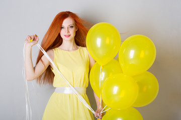 Young woman with balloons