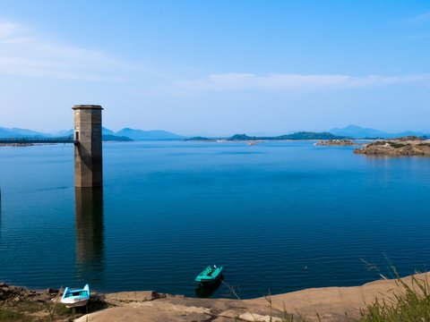 Beautiful Lake Landscape with boats Maintenance Watch Tower bridge in Senanayake Samudraya Galoya National Park Inginiyagala, Ampara, Sri Lanka