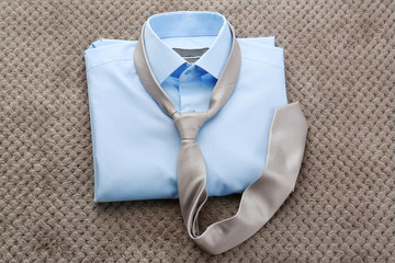 New man shirt with tie on grey background