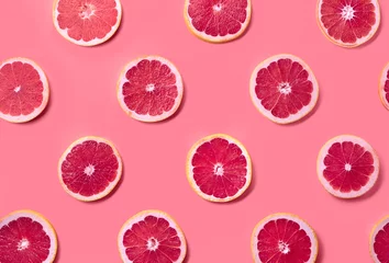 Tuinposter Colorful pattern of grapefruit slices © baibaz