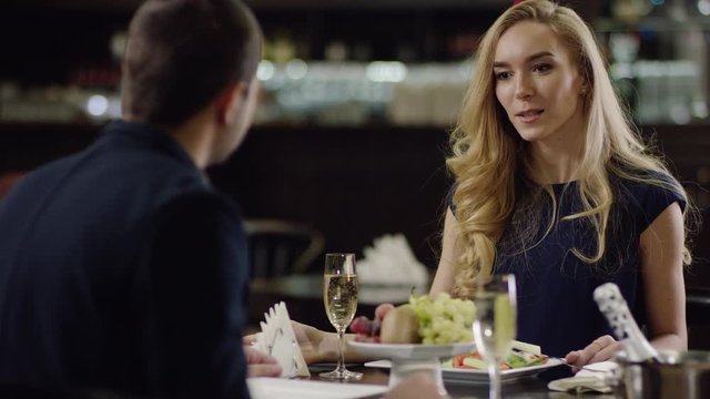 pair has a date in restaurant