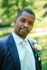 Handsome bearded man or african American groom