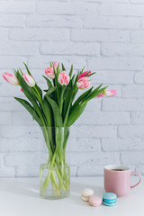 Tulips, macaron and cup of tea on March 8th.