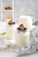Obraz na płótnie Canvas Homemade natural yogurt with blueberry and raspberry, selective focus