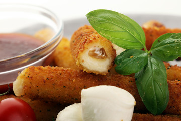 Breaded mozzarella cheese sticks with tomato ketchup and bbq sauce