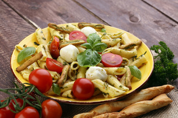 Traditional Italian penne pasta, fresh mozzarella, fresh tomato and sun dried tomato meal