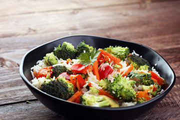Colorful rice and vegetable salad - fresh mixed colorful healthy vegetarian food