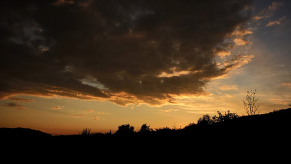 Dramatic clouds during sunset on meadow. Slovakia