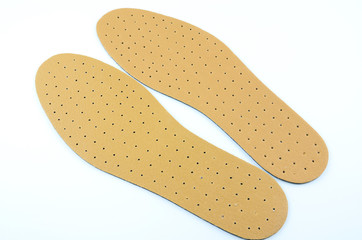 Brown leather shoe insoles..