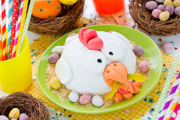 Easter chicken fondant cake on festive decorated table