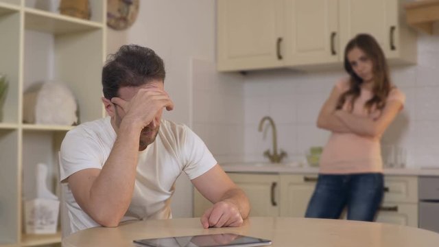 Offended husband and wife silent after conflict, problems in marriage, divorce