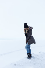 Fototapeta na wymiar Girl on a background of a white field