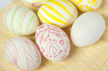 Closeup of beautiful Easter eggs with their hands. A festive mood. 
