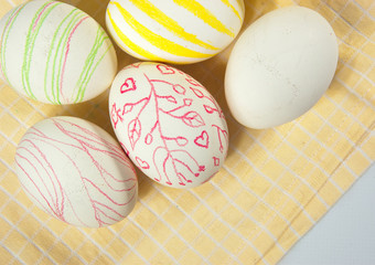 Closeup of beautiful Easter eggs with their hands. A festive mood. 
