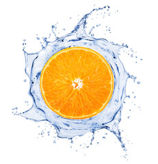 Orange is surrounded by a splash of water on white background