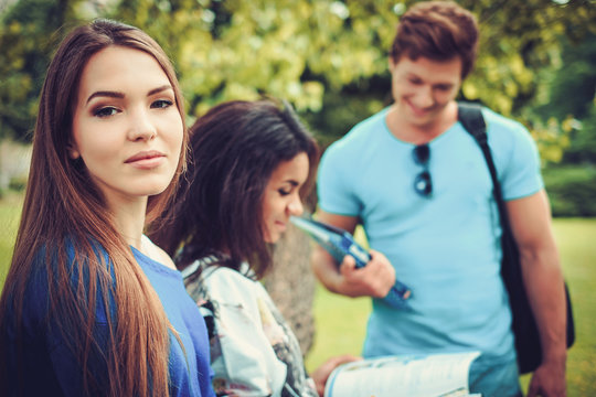 Group of multi ethnic students in a city park