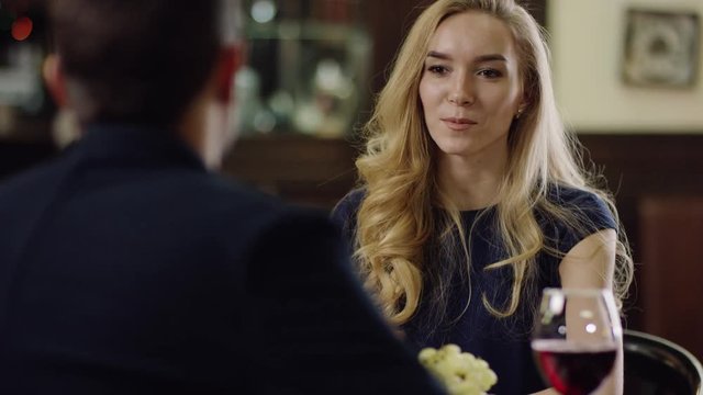 pair has a romantic date in restaurant