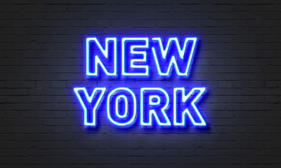 New York neon sign on brick wall background.