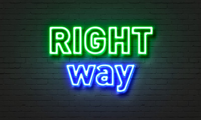 Obraz premium Right way neon sign on brick wall background.