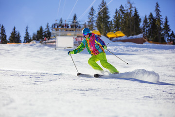 Male skier carving turn on mountain slope