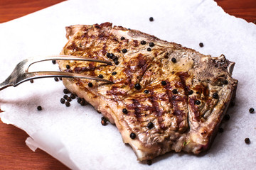 grilled fiorentina steak over  paper
