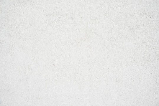 Abstract grungy empty background.Photo of blank white concrete wall texture. Grey washed cement surface.Horizontal.