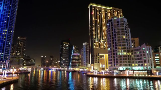 UHD 4K Dubai Marina night time lapse, United Arab Emirates. Dubai Marina - the largest man-made marina in the world. Dubai Marina is a canal city, carved along a 3 km stretch of Persian Gulf shoreline